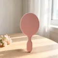 Specchio da trucco ovale rosa, specchietto cosmetico portatile con comoda impugnatura. - Rosa