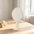 Semplice specchio per trucco ovale a mano, specchio cosmetico portatile bianco macaron. - Grigio