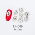 Close-up detail of cat paw shape AB crystal nail art rhinestones, sparkling glass crystal decor. - Cat Paw Irregular Rhinestone (LF-C09) / 10 Pieces/Pack