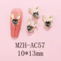 Gold rabbit ear nail charms detail view, black rhinestone metal DIY nail art accessories. - AC57