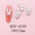 Detailed shot of cute bunny ear rhinestone nail art charms, alloy design, size 10x13mm. - AC69 White Moonlight