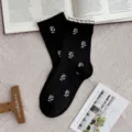 Black mid-calf cotton socks with cute white tulip floral pattern and ruffled bubble cuffs. - One Size / Black
