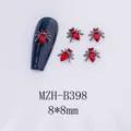 Nahaufnahme Detail von dunklen gotischen Spinnen-Nagelkunst-Anhängern mit roten Strasssteinen. - Rote Strass Spinne Stil (B398)