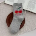 Cozy grey crew socks featuring cute smiling cherry pattern and CHERIE text, soft daily wear. - One Size / Gray