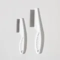 Detailed view of pet flea comb with precise dimensions, showing metal fine teeth and handle. - L