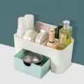 Plastic desktop cosmetic organizer with drawer, multi-compartment makeup storage display. - Nordic Blue