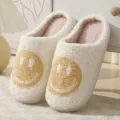 Cozy fluffy winter slippers for women and men, cute white plush home shoes with yellow smiley face. - Milk Khaki