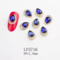 Blue teardrop nail rhinestones with gold base and clear crystals, 9x11.6mm nail charms. - 5716