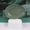 Green leaf plastic snack plate, stylish fruit tray variant for modern kitchen use. - Nordic Blue