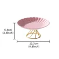 Pink ceramic cake plate detail featuring geometric gold metal stand and wavy edge. - Octagonal Elevated Saucers - Pink Chrysanthemum Pattern