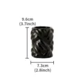 Detail view of black ceramic braided cylinder vase, showing compact modern decor size. - S / Black