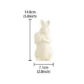 Ceramic Easter rabbit figurine holding an egg with bow tie, cute desktop home decoration ornament. - Left / White