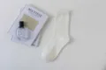 Solid color ribbed mid-calf cotton socks for women, simple and casual daily wear style. - Female Style / Creamy White