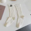 White ribbed distressed high socks for women, trendy embroidered casual knit tube socks. - One Size / White