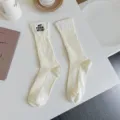Distressed embroidered high tube socks for women, fashionable ins style mid-thick stack socks. - One Size / Creamy White