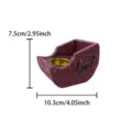 Detail view of the resin incense burner showing Arabic calligraphy and gold metal inner bowl. - Boat Shape Black Lettering Incense Burner (O) / Red