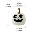 White resin Halloween pumpkin figurine with spooky carved face, tabletop holiday decor. - Four-Color Resin Pumpkin - White