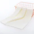 Soft coral fleece face towel in cream white with wavy edges, premium plush textile for daily use. - 35*75cm / Off White