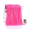 Thick soft absorbent pink towel for salon and bathroom use, elegant display with rack. - Pink