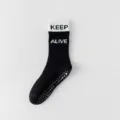 Black yoga socks for women, non-slip grip athletic socks with motivational text keep alive. - One Size / Black