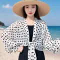 Wide sleeve polka dot sun protection cover-up shawl detail view, breathable lightweight fabric. - White
