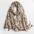 Detailed view of abstract floral print cotton linen scarf featuring elegant black tassels. - Style 2
