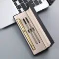 Gold metal ballpoint pen gift set with two refills packed in an elegant black gift box. - Luxury Gold Pen with Two Refills and Pen Box