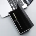 Elegant black metal rollerball pen presented in a luxury gift box, perfect for business use. - Black Pen with Gold Trim + 073# Box