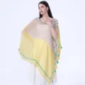 Ethnic style women's cape with Chinese knot buttons and tassels, perfect for travel photos. - Yellow-Green