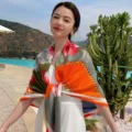 Detailed view of women's large square silk scarf with floral and chain print, elegant shawl. - Style 6