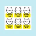 Close-up detail of cute cat thank you stickers sheet, perfect for packaging and baking decoration. - Cat