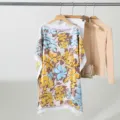 Detail view of a floral printed boat-neck loose top, showcasing the smooth fabric and print. - 90X90cm Loose Short Style / Style 4