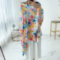 Detail view of a vibrant floral print cotton linen shawl, showcasing colorful design patterns. - L263