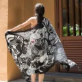 Black and white printed oversized scarf shawl detail view, elegant floral pattern for sun protection. - L90 Black and White