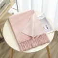 Close-up detail view of soft pink reversible winter scarf with elegant tassel fringe design. - Color 10