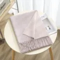 Double-sided solid color imitation cashmere scarf detail showing soft warm tassel design. - Color 9
