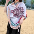 Detailed view of a retro ethnic style women shawl, featuring colorful floral prints and soft fabric. - 315