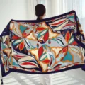 Ethnic style imitation silk square scarf variant, vibrant floral pattern for holiday. - 230 GSM