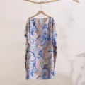 Detailed view of the stylish summer paisley printed silk-like sun protection shawl and cover-up. - 28