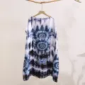 Detail of blue white tie-dye sun protection clothing with pagoda and butterfly print. - 18