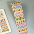 Cute washi tape roll with various floral and fruit patterns for journaling and DIY crafts. - 300 Pcs/Roll / SYF-69