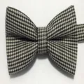 Classic black and white houndstooth bow tie detail, elegant gentleman fashion accessory. - Houndstooth 2