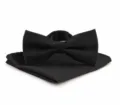 Detailed view of the black textured bow tie and pocket square set, elegant accessory close-up - Black