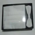 Detailed shot of white men formal cummerbund and bow tie set in black box, wedding accessory. - One Size / White