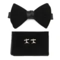 Black velvet bow tie, pocket square and cufflink detail shot for men's formal wedding suit. - Black
