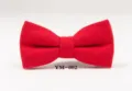 Red wool bow tie detail shot, showing the delicate fabric texture and classic shape. - YM-002