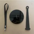 Set parti supporto filato da polso portatile, cinturino in pelle e disco in acrilico nero. - Modello B / Nero