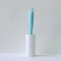 Blue lint roller with replacement sticky paper, perfect for cleaning clothes and pet hair easily. - Mint Green