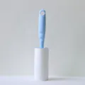Lint roller with blue handle and white refillable sticky paper for clothes hair removal. - Ocean Blue