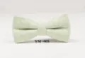 Green wool bow tie detail close-up, classic textured fabric design for men formal wear. - YM-005
